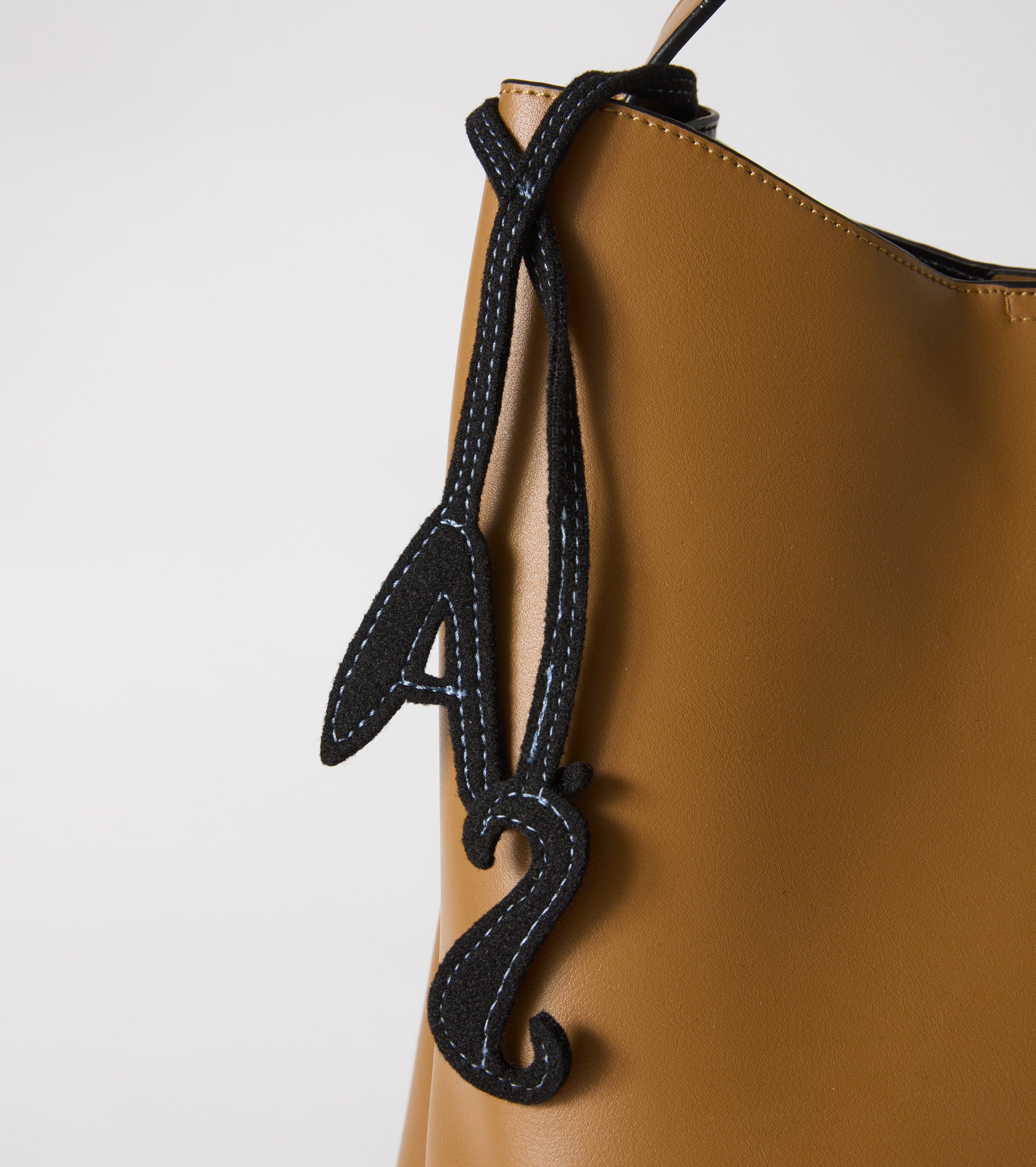Bucket bag with charm