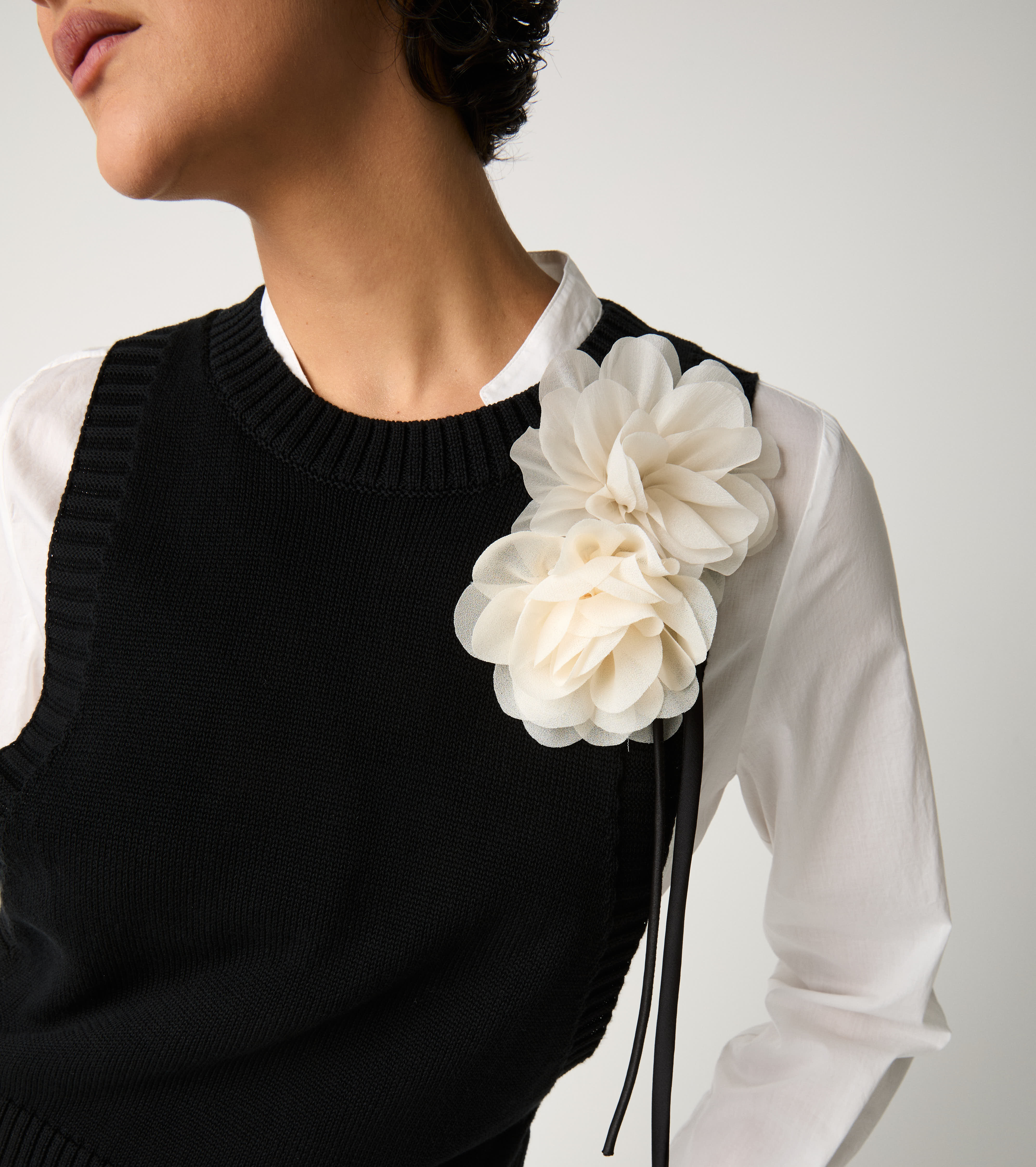 Black knitted crew-neck waistcoat